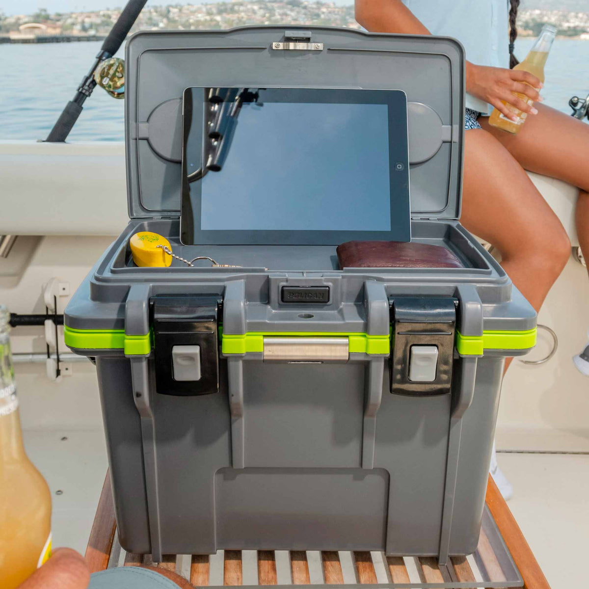 14QT Personal Pelican Cooler being used on a boat with the dry box lid opened 