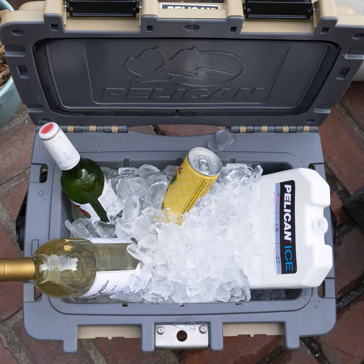 20QT Pelican Elite Cooler filled with ice, a 2lb Pelican Ice pack and beverages 