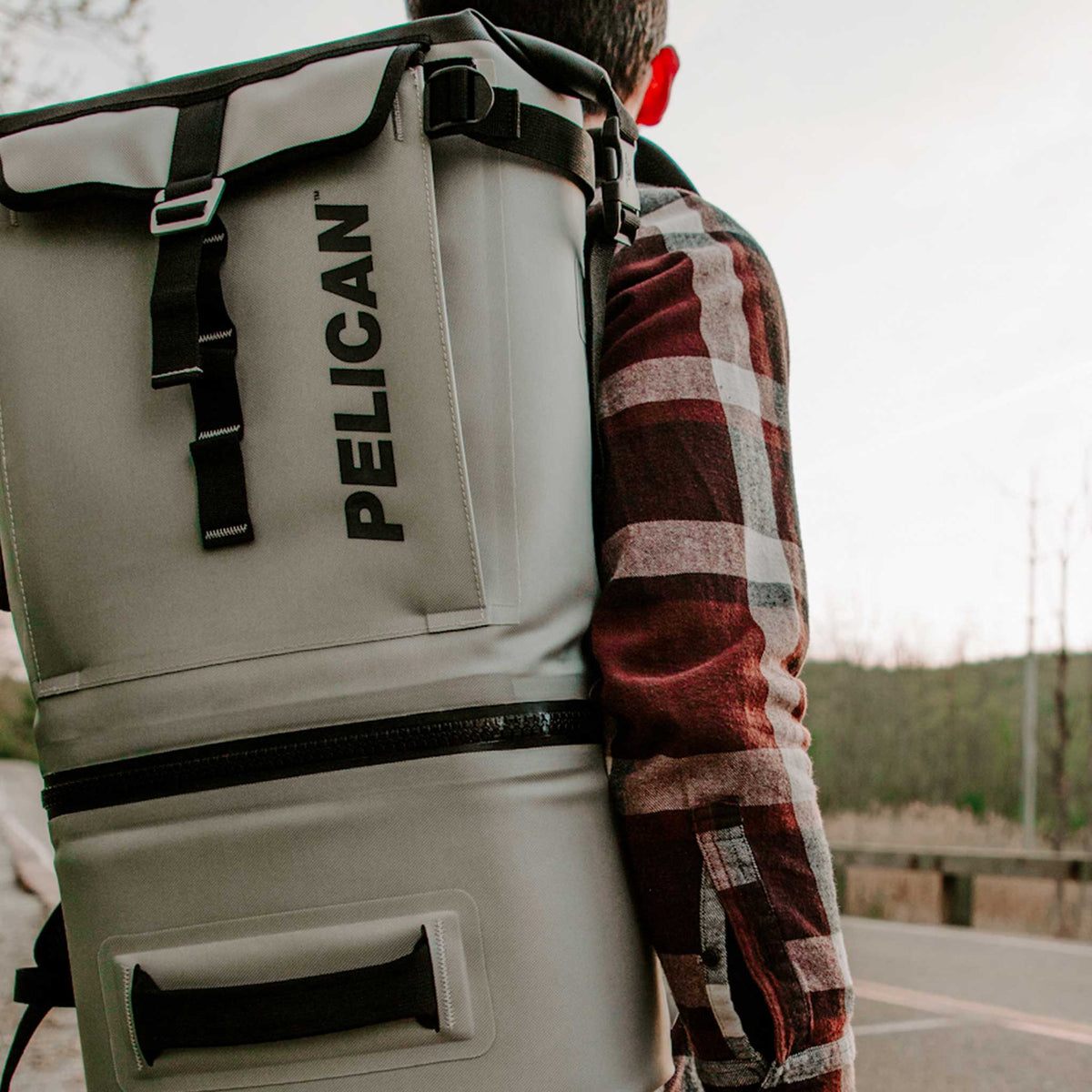 SOFT-CBKPK-LGRY Pelican™ Dayventure Backpack Soft Cooler being used outside