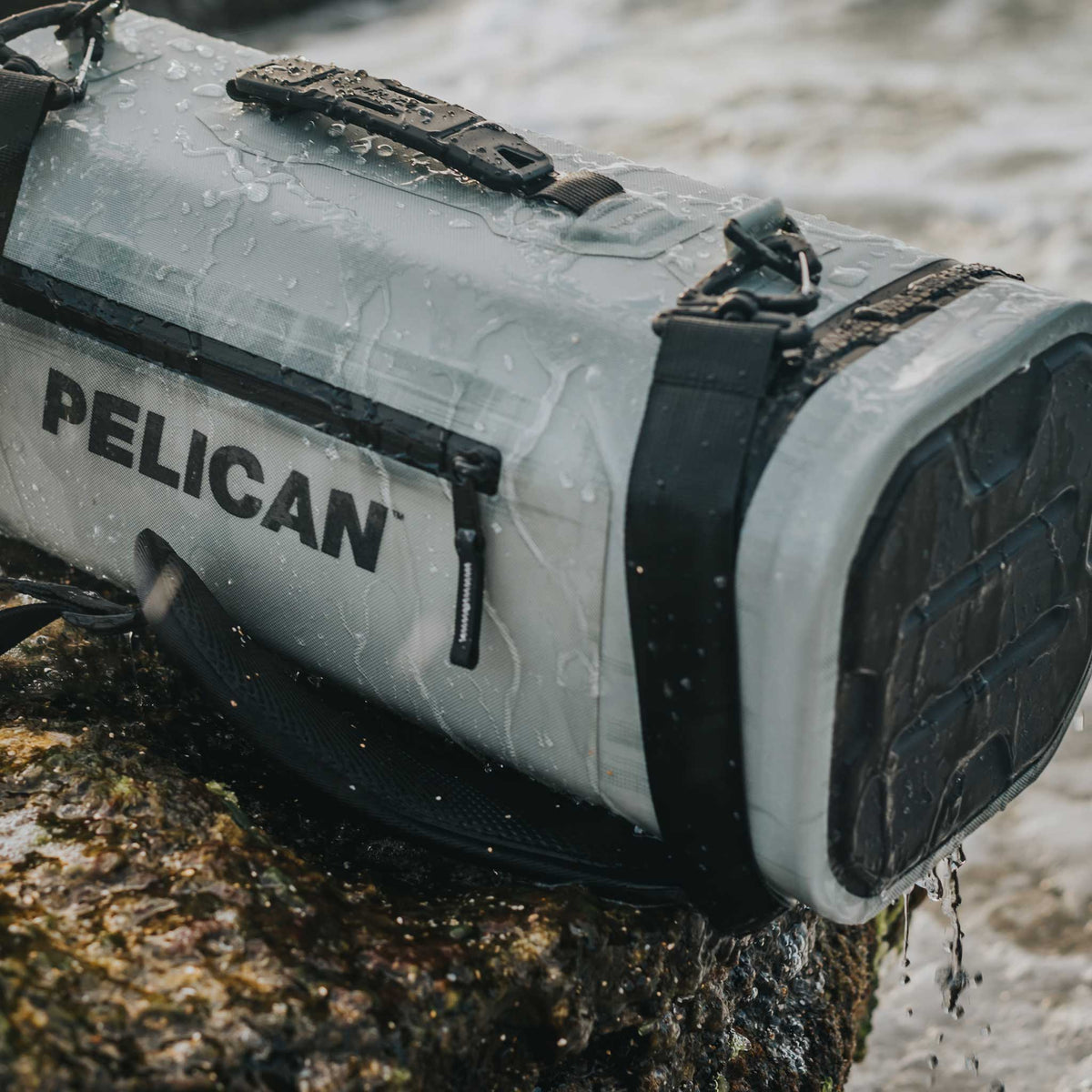 Pelican™ Dayventure Sling Soft Cooler with water dripping off it