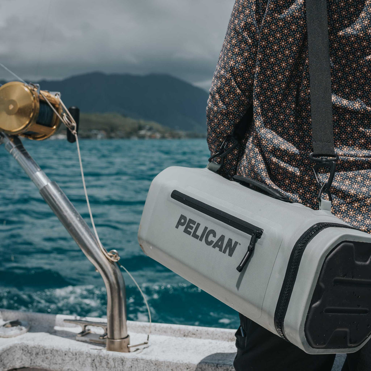 Pelican™ Dayventure Sling Soft Cooler be used on the ocean with the strap